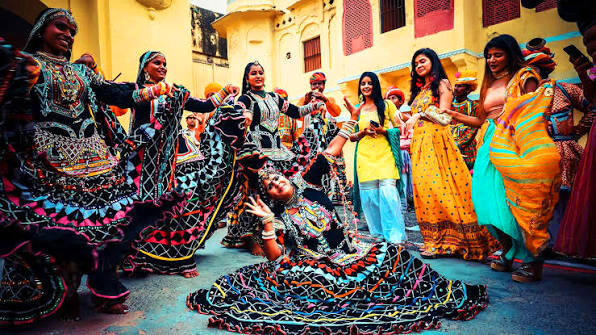 Kalbeliya dancers spinning with live been musicians
